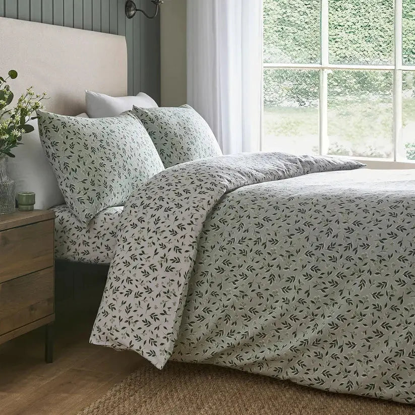 Bedroom with floral-patterned bedding and a window view